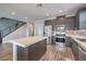 Open kitchen featuring a center island, modern cabinetry and stainless steel appliances at 1056 Via Panfilo Ave, Henderson, NV 89011