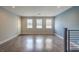 Well-lit, open living space with large windows and modern flooring, perfect for a comfortable and stylish home at 1056 Via Panfilo Ave, Henderson, NV 89011