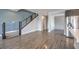Stylish living area with staircase and kitchen access, boasting modern design and spacious, open concept at 1056 Via Panfilo Ave, Henderson, NV 89011