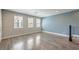 Bright, open living area with large windows and modern flooring, offers flexibility for design and comfort at 1056 Via Panfilo Ave, Henderson, NV 89011