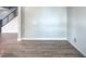 Spacious living room featuring hardwood floors and staircase access at 1056 Via Panfilo Ave, Henderson, NV 89011