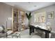 Home office features modern decor, shelves, a desk, and a comfortable sitting area at 1056 Via Panfilo Ave, Henderson, NV 89011