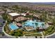 Aerial view of the community pool area, featuring a main pool, pool, and palm trees at 1056 Via Panfilo Ave, Henderson, NV 89011