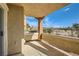 Relaxing private balcony showcasing desert landscaping with a clear, blue sky at 10800 Amber Ridge Dr # 103, Las Vegas, NV 89144