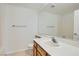 Bright bathroom featuring a single sink and large mirror at 10800 Amber Ridge Dr # 103, Las Vegas, NV 89144