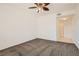 Spacious bedroom featuring neutral carpet and modern ceiling fan at 10800 Amber Ridge Dr # 103, Las Vegas, NV 89144