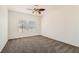 Bright bedroom with large windows and soft, neutral carpet at 10800 Amber Ridge Dr # 103, Las Vegas, NV 89144