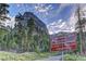 Cathedral Rock trailhead sign amidst towering pines and a dramatic mountain backdrop at 10800 Amber Ridge Dr # 103, Las Vegas, NV 89144