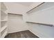 Walk-in closet featuring custom shelving and rod hanging at 10800 Amber Ridge Dr # 103, Las Vegas, NV 89144