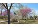 Charming gazebo surrounded by flowering trees and lush lawn with geese at 10800 Amber Ridge Dr # 103, Las Vegas, NV 89144
