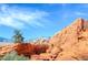 Expansive desert landscape with red rocks, sparse vegetation, and distant mountain views under a blue sky at 10800 Amber Ridge Dr # 103, Las Vegas, NV 89144