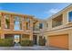 Lovely townhouse with a tandem garage and beautiful architecture details and professional landscaping at 10800 Amber Ridge Dr # 103, Las Vegas, NV 89144