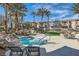 Relaxing hot tub area with lounge chairs and scenic views of the pool and grounds at 10800 Amber Ridge Dr # 103, Las Vegas, NV 89144