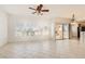 Bright and spacious living room with neutral tile flooring and large windows offering an abundance of light at 10800 Amber Ridge Dr # 103, Las Vegas, NV 89144