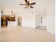 This expansive living room has neutral tile and offers access to the kitchen and front entryway at 10800 Amber Ridge Dr # 103, Las Vegas, NV 89144