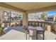 Outdoor seating and grilling area located near the community pool at 10800 Amber Ridge Dr # 103, Las Vegas, NV 89144