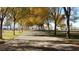 Scenic park pathway lined with trees and lush green grass on a sunny day at 10800 Amber Ridge Dr # 103, Las Vegas, NV 89144