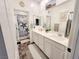 Stylish bathroom with dual sinks, modern fixtures, and marine-themed decor with mirrors at 10819 Far Country Ave, Las Vegas, NV 89129
