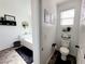 Bright bathroom featuring tile flooring, modern toilet and window at 10819 Far Country Ave, Las Vegas, NV 89129