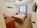 A cozy bedroom with a ceiling fan, warm lighting and neutral color scheme at 10819 Far Country Ave, Las Vegas, NV 89129