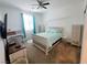 Bright bedroom with a ceiling fan, large window, and a charming, well-lit atmosphere at 10819 Far Country Ave, Las Vegas, NV 89129