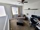 Cozy upstairs bonus room featuring neutral paint, a ceiling fan and comfortable seating at 10819 Far Country Ave, Las Vegas, NV 89129