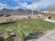 Inviting community park features well-maintained lawns, walking paths, seating areas, and mountain views at 10819 Far Country Ave, Las Vegas, NV 89129