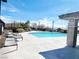 Inviting community pool featuring lounge chairs and mountain views, perfect for relaxation at 10819 Far Country Ave, Las Vegas, NV 89129