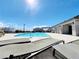 Relaxing community pool with lounge chairs, pergola, and mountain views in a great neighborhood at 10819 Far Country Ave, Las Vegas, NV 89129
