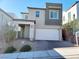 Charming two-story home with a two-car garage, welcoming entryway, and low maintenance landscaping at 10819 Far Country Ave, Las Vegas, NV 89129