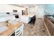 Bright kitchen with stainless steel appliances, island seating, and adjacent dining area and living room at 10819 Far Country Ave, Las Vegas, NV 89129