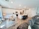 Bright, open kitchen with a large island and adjoining dining area, flowing into the living room at 10819 Far Country Ave, Las Vegas, NV 89129