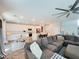 Cozy open-concept living room and kitchen featuring a large sectional sofa at 10819 Far Country Ave, Las Vegas, NV 89129
