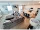 Spacious living room with a large sectional sofa open to modern kitchen at 10819 Far Country Ave, Las Vegas, NV 89129