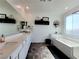 Open and bright main bathroom featuring double sinks, a separate tub and shower at 10819 Far Country Ave, Las Vegas, NV 89129