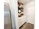 Mud room features white cabinets, decor, and access to garage and backyard at 10819 Far Country Ave, Las Vegas, NV 89129