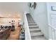 Carpeted staircase leading to second floor, adjacent to kitchen and living room at 10819 Far Country Ave, Las Vegas, NV 89129