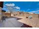 Backyard retreat includes a patio with brick accents, stylish seating, and mountain views at 112 Austin Rose Ave, Henderson, NV 89002