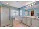 Bright bathroom includes a glass shower, tub, and a double sink vanity for convenience at 112 Austin Rose Ave, Henderson, NV 89002