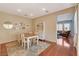 Open dining area with light walls, wood floors and view to adjacent room at 112 Austin Rose Ave, Henderson, NV 89002