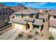 Stunning two-story home boasts a tile roof, desert landscaping, and a two-car garage, set against a mountain backdrop at 112 Austin Rose Ave, Henderson, NV 89002
