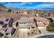 Charming two-story home showcases desert landscaping and attached two car garage at 112 Austin Rose Ave, Henderson, NV 89002