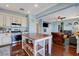 Well-appointed kitchen with white cabinets, stainless steel appliances, and a view to the living room at 112 Austin Rose Ave, Henderson, NV 89002