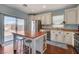 Modern kitchen with white cabinets, stainless steel appliances, and a large center island at 112 Austin Rose Ave, Henderson, NV 89002