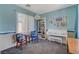 Bright living space featuring stylish furniture, decor, and a large window for natural light at 112 Austin Rose Ave, Henderson, NV 89002