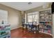 Well-lit room with hardwood floors, window, and built-in shelving, ideal for a home office or study at 112 Austin Rose Ave, Henderson, NV 89002