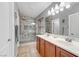 Bathroom featuring double sinks and glass shower at 1150 Red Margin Ct # 101, Las Vegas, NV 89183