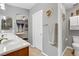 Bathroom with double sinks and a doorway to a bedroom at 1150 Red Margin Ct # 101, Las Vegas, NV 89183