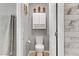 This bathroom features neutral paint, stylish tile, and a white toilet and sink at 1150 Red Margin Ct # 101, Las Vegas, NV 89183