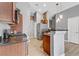 A modern kitchen with stainless steel appliances and warm wood cabinetry offers a practical cooking space at 1150 Red Margin Ct # 101, Las Vegas, NV 89183